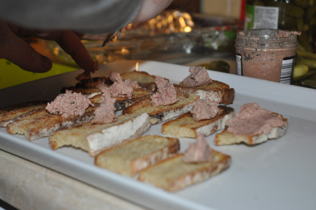 Preparing the canapes. Homemade bread with pheasant liver pate... I didn't manage to get a shot of them with the cranberry garnish. O well. 