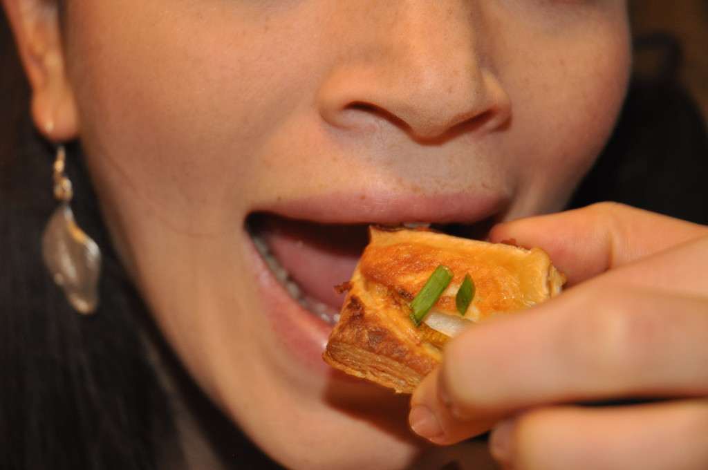 Sarah enjoying one of those pear and goat cheese tartlets!